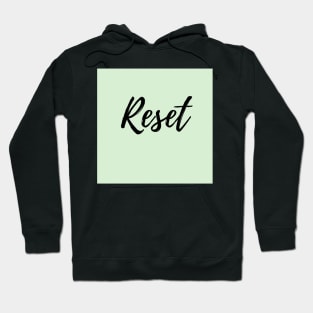 Reset - positive affirmation word, green background Hoodie